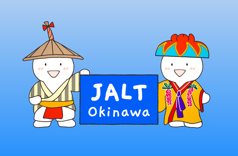 Okinawa JALT mascots Nini and Nene holding a JALT Okinawa sign